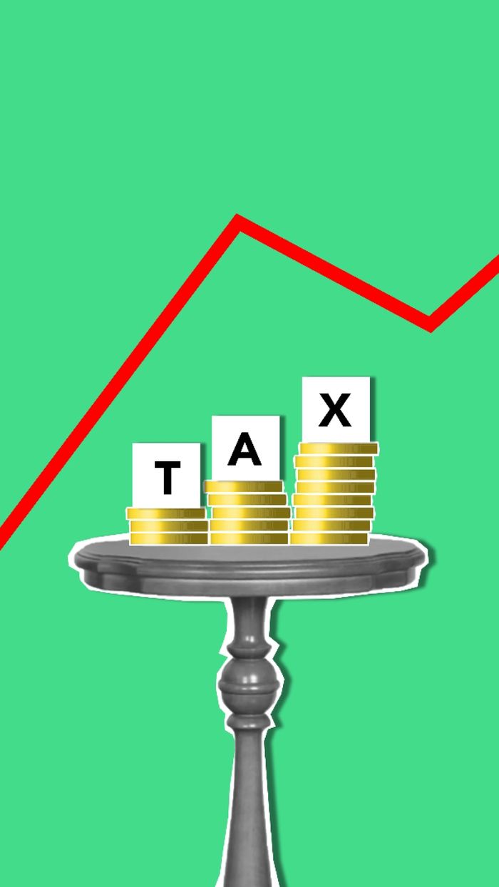 Crafting Captivating Headlines: Your awesome post title goes here Cutout paper composition representing concept of tax with coins on table under graph on green background